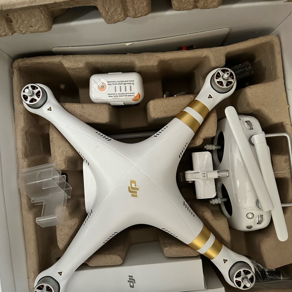 DJI White and Gold Drone with Controller